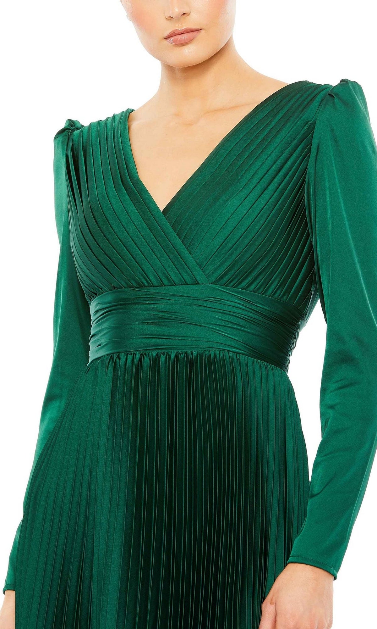 A woman wears the Long Formal Dress 26542 by Mac Duggal, featuring long sleeves, an emerald green pleated design, a V-neckline, and a fitted waist.